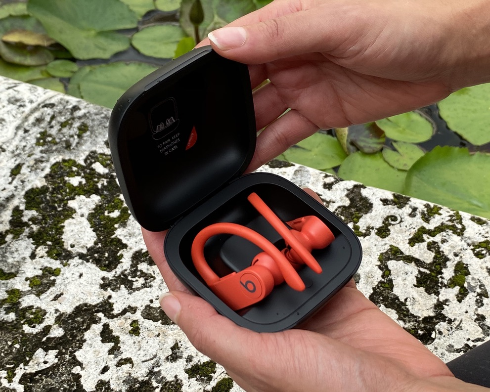 The Beats Powerbeats Pro wireless earbuds stored in their charging case