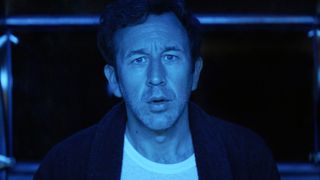 Chris O'Dowd as Dusty in The Big Door Prize, bathed in blue light