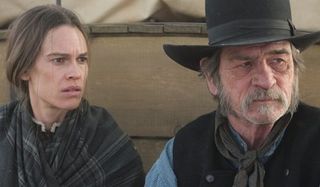 The Homesman Hilary Swank Tommy Lee Jones looking off into the Prairie