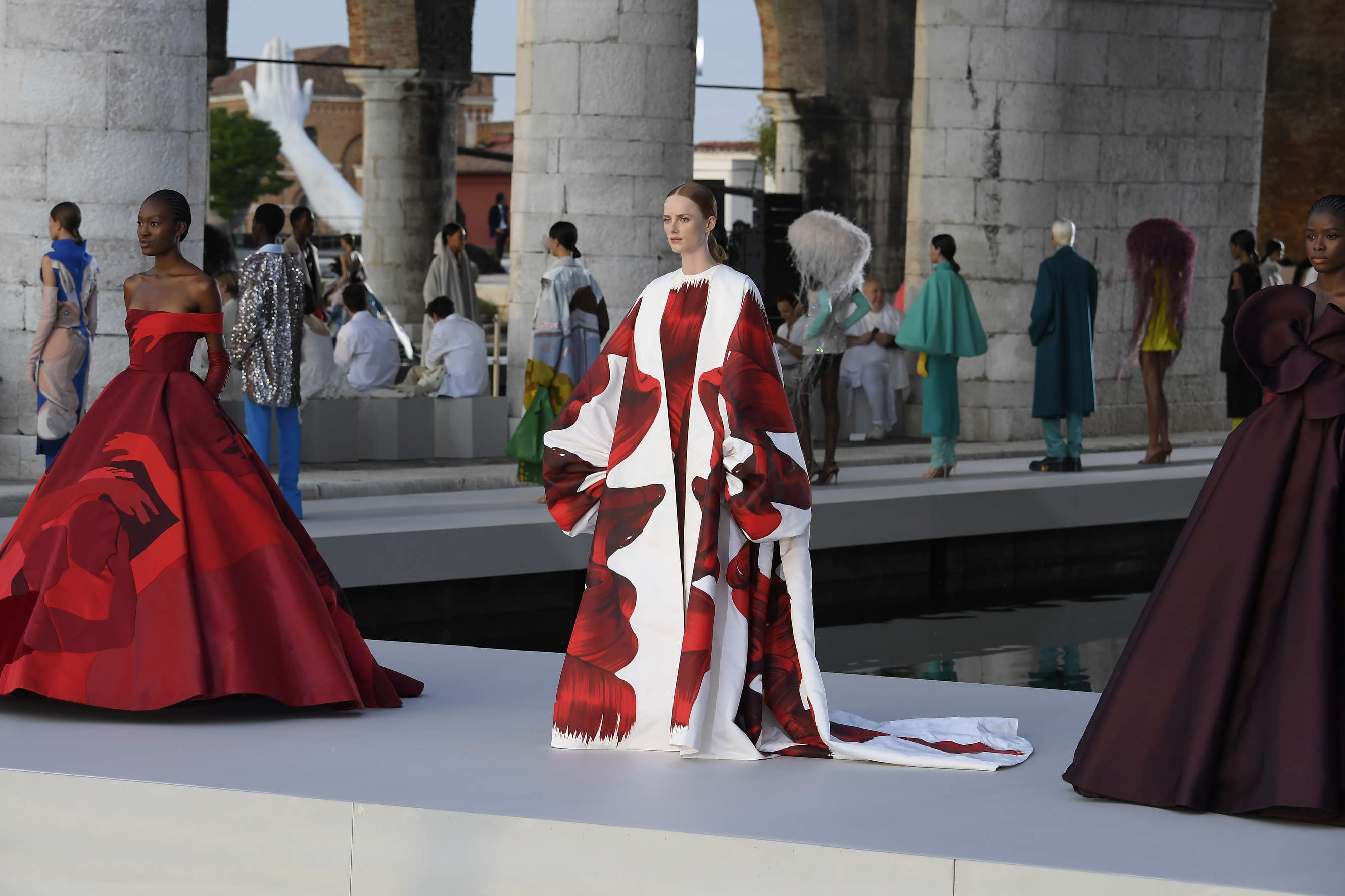 Model wears a red gown at Valentino A/W 2021 Haute Couture show