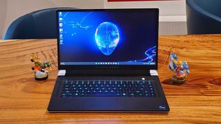 An Alienware x15 R2 gaming laptop on a wooden table
