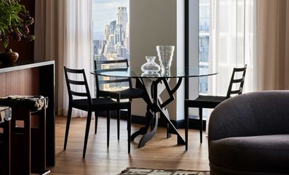 an apartment dining room with a glass table