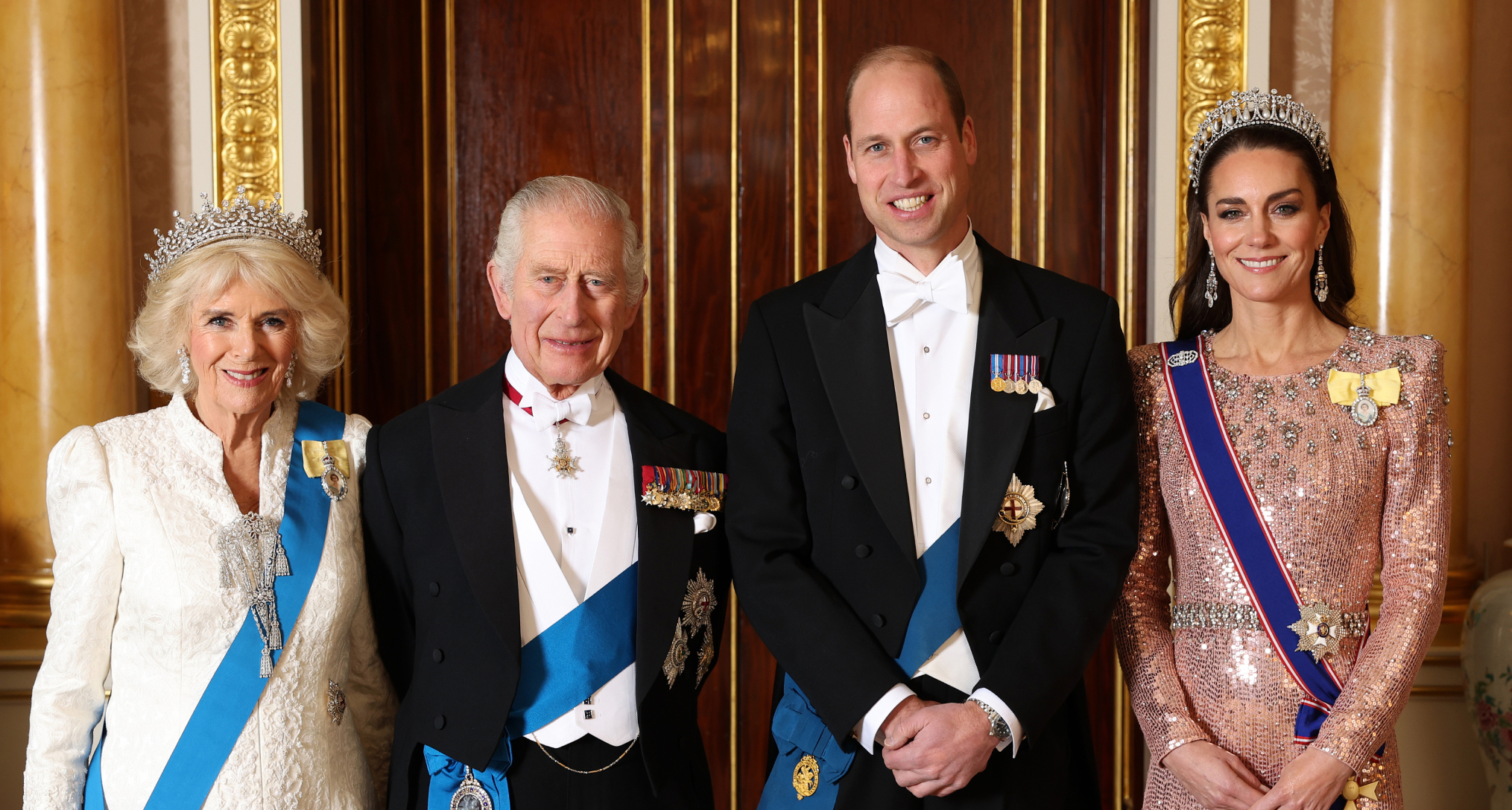 Queen Camilla, King Charles, Prince William Princess Kate posing in formalwear