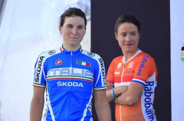 Borghini heads for the podium while Vos watches on