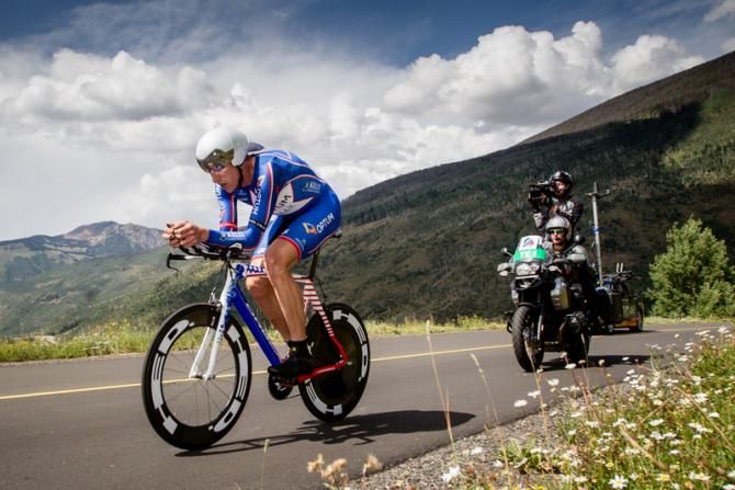 Tom Zirbel (Optum) passes by wearing the national champion's colors.