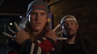 Jason Mewes and Kevin Smith mug for the camera at night in Clerks III.
