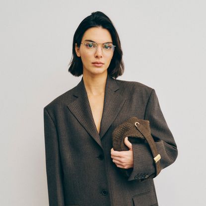 Kendall Jenner in front of a blank wall for calvin klein