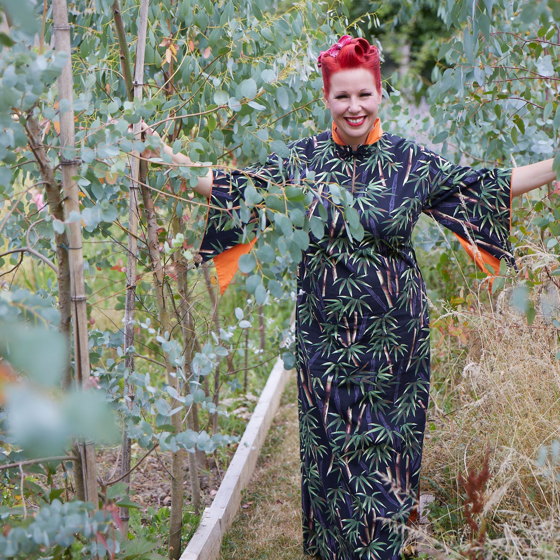 Angel Strawbridge in ther garden surrounded by eucalyptus