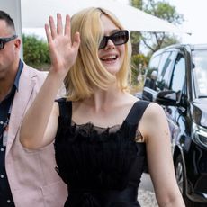 Elle Fanning wears a black dress