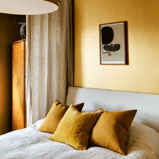 Gold painted walls with gold bedroom interiors