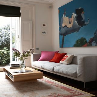 living room with sofa set and cushions