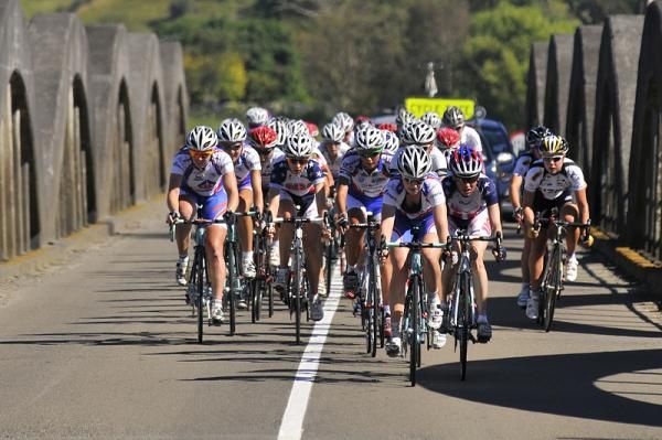 The peloton has reformed after the descent as they enter the township of Pahiatua.