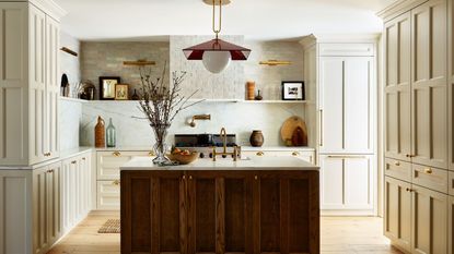 modern rustic kitchen with wooden island, warm neutral cabinets and walls