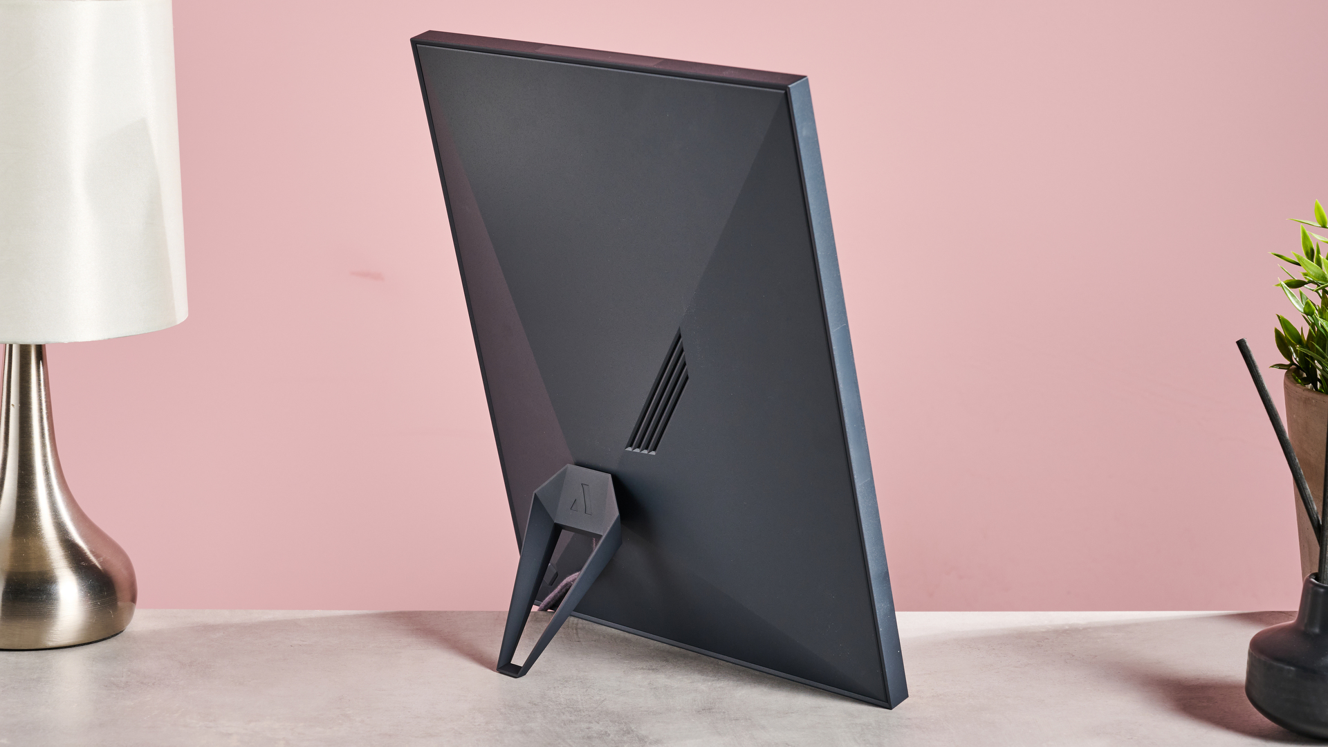 The rear of the Aura Aspen, showing off its triangular stand and rear speaker.