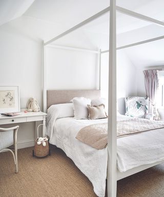 White four poster bed, white desk