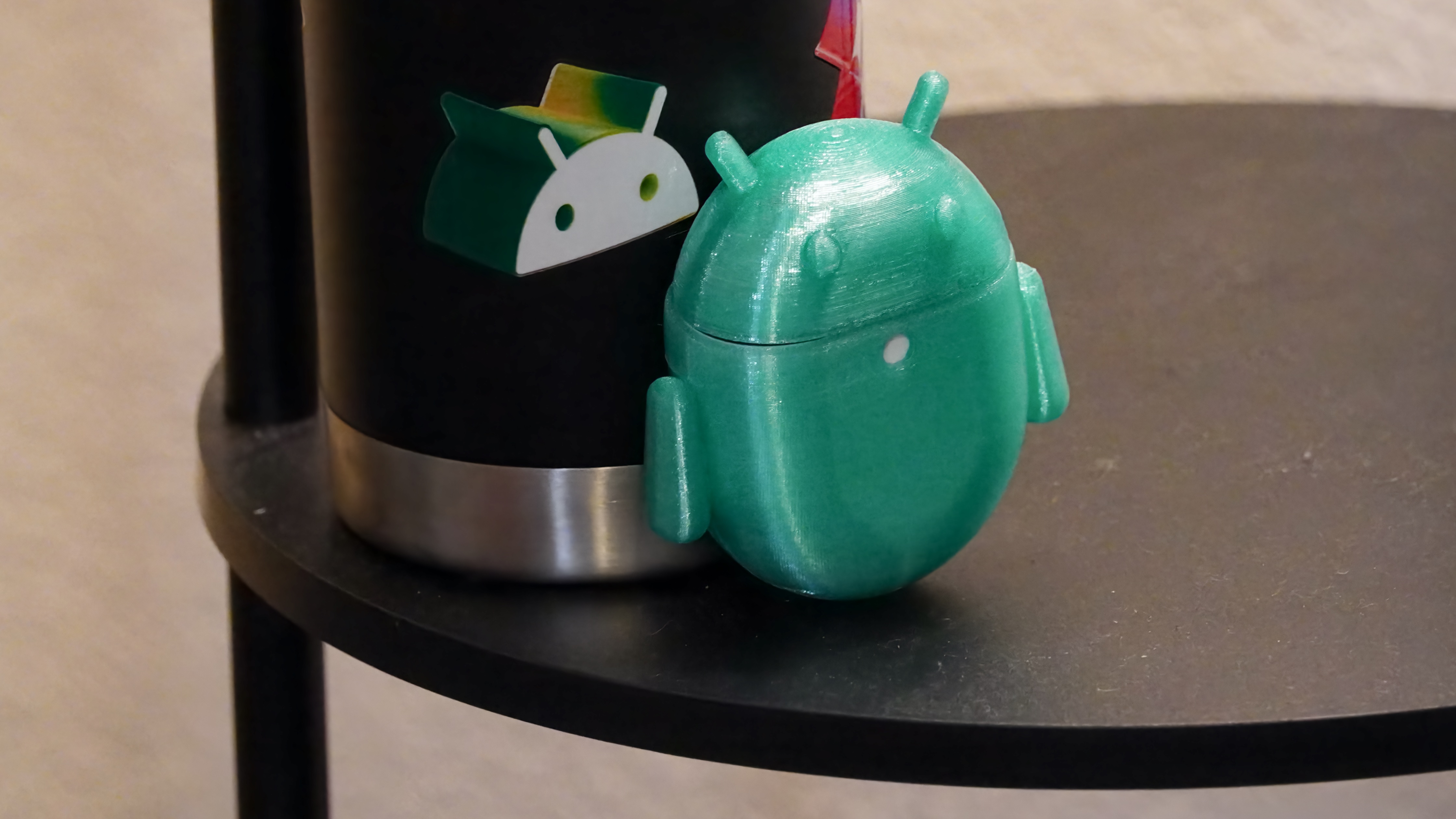 The Android Bot 3D-printed case on a pair of Google Pixel Buds Pro 2.