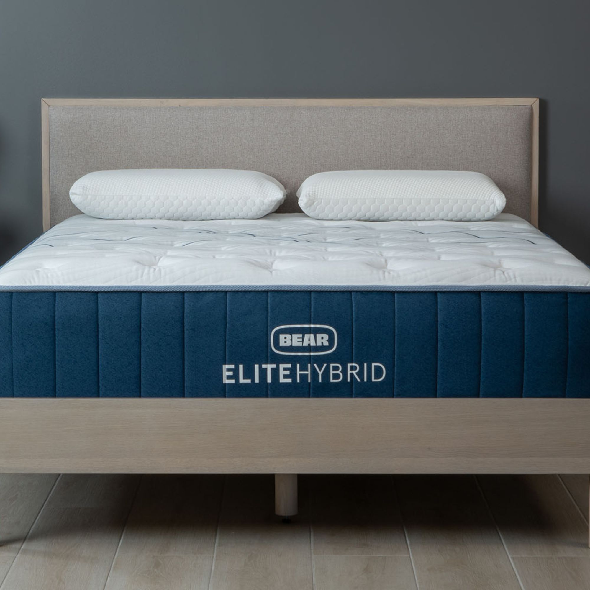 Bear Elite Hybrid Mattress against a gray wall.