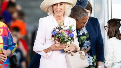 Queen Camilla wearing a Lady Dior bag