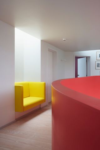 Maggie centre red counter and yellow alcove seating