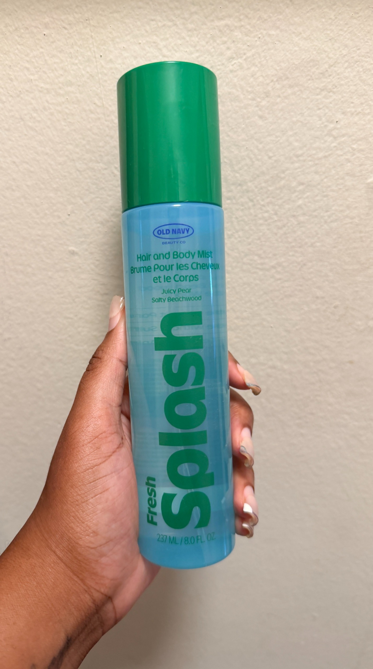 Ariel Baker testing Old Navy Fresh Splash body mist.