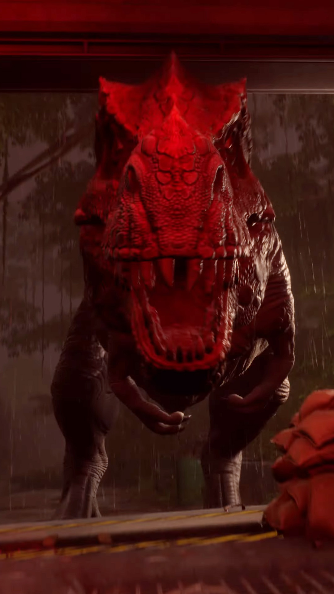 A T-rex cast in a red hue from Deathground as it breaks through a steel door