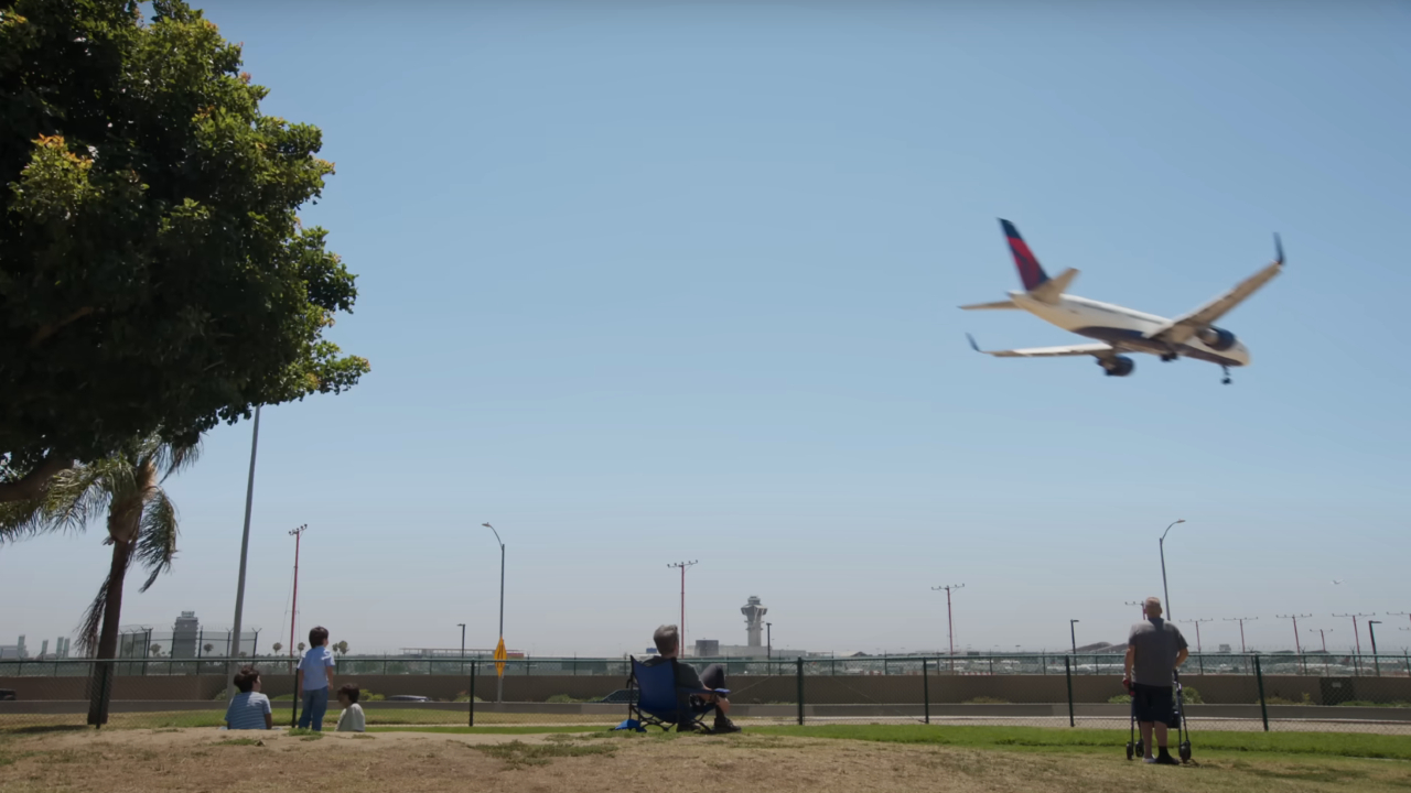 Nathan Fielder watching a plane land on The Rehearsal