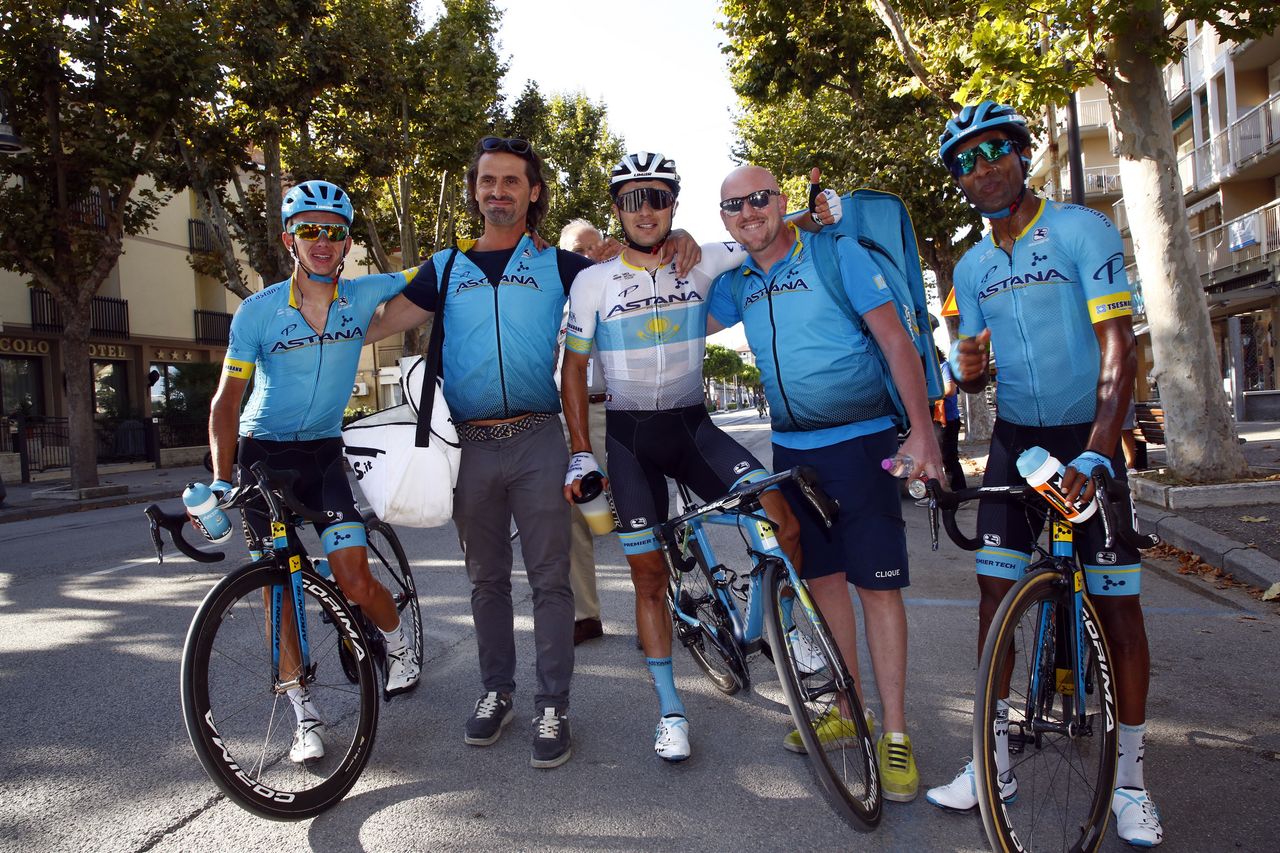 Astana teammates and soigneurs celebrate with Lutsenko after his win