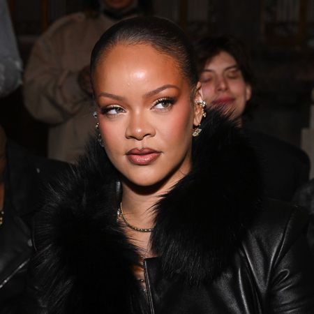 Photo of Rihanna wearing a black jacket at Paris Fashion Week