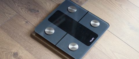 Vitafit smart scale on a wooden floor