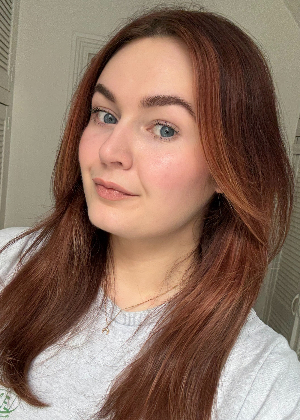 Lucy wearing the Haus Labs Glassy Blush Balm Stick in Glassy Ginger
