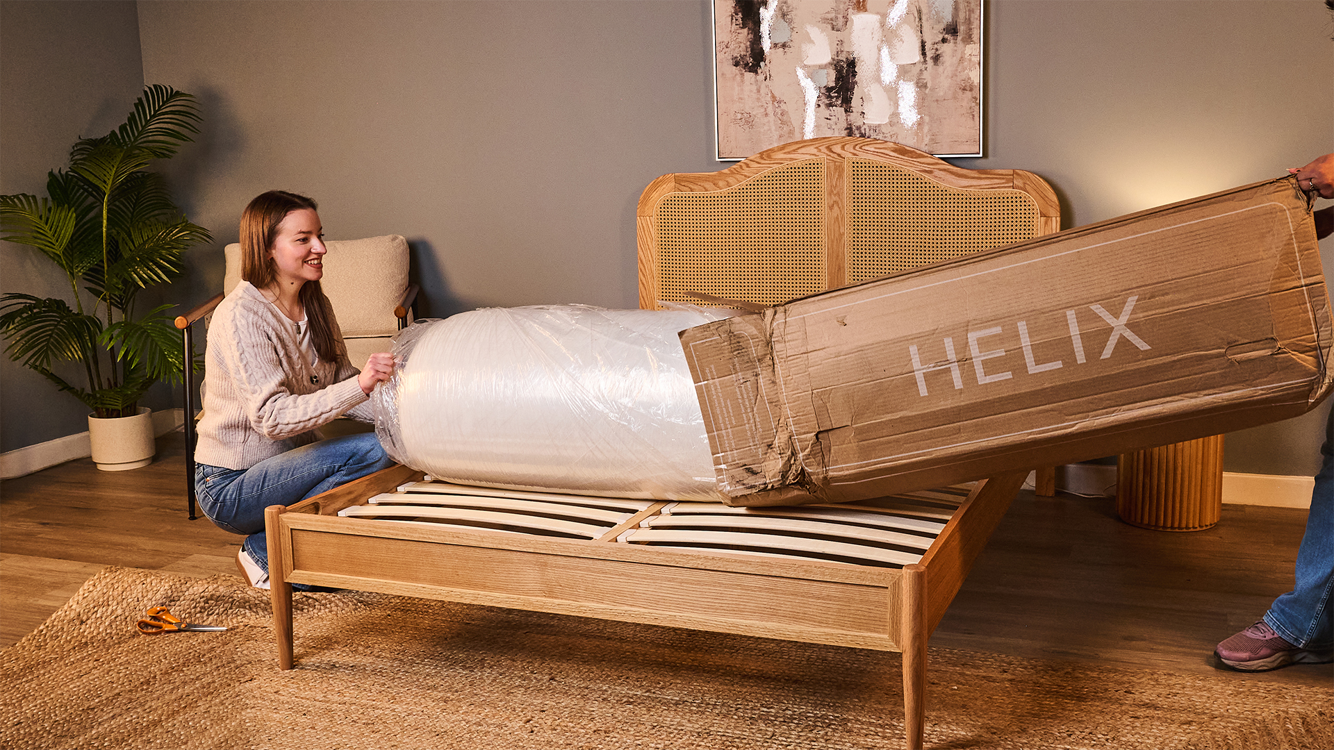Frances Daniels unboxes the Helix Twilight mattress in a warmly lit room