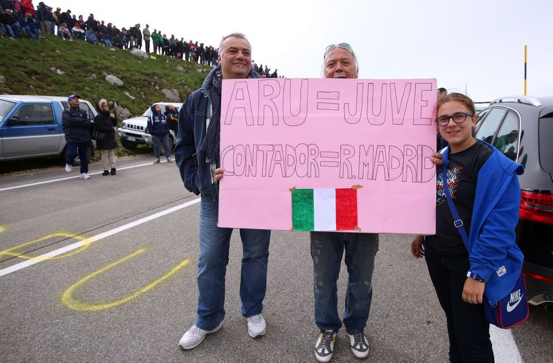Some fans with their sign reminding the peloton of Juve's semi final victory over Real Madrid in the champions league and that another Italian victory over Spain is on the cards at the Giro