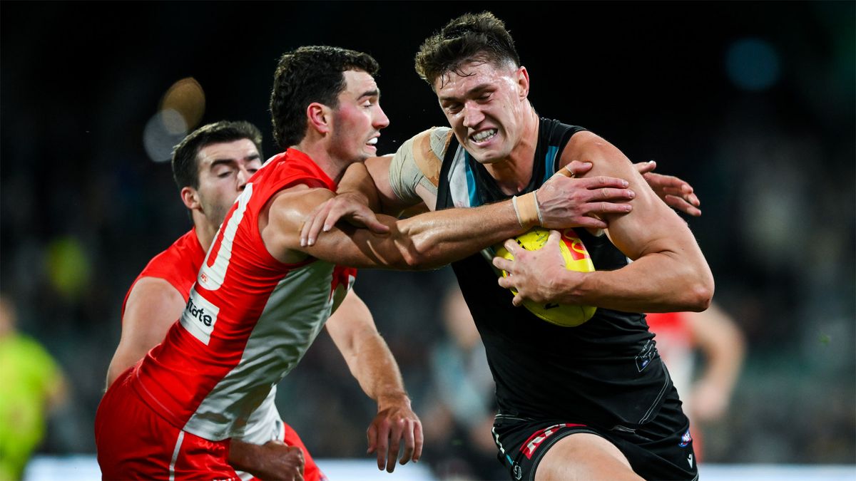 Port Adelaide&#039;s Jordon Sweet is tackled by Sydney&#039;s Tom McCartin ahead of the 2024 AFL Preliminary Final live stream between the two sides.