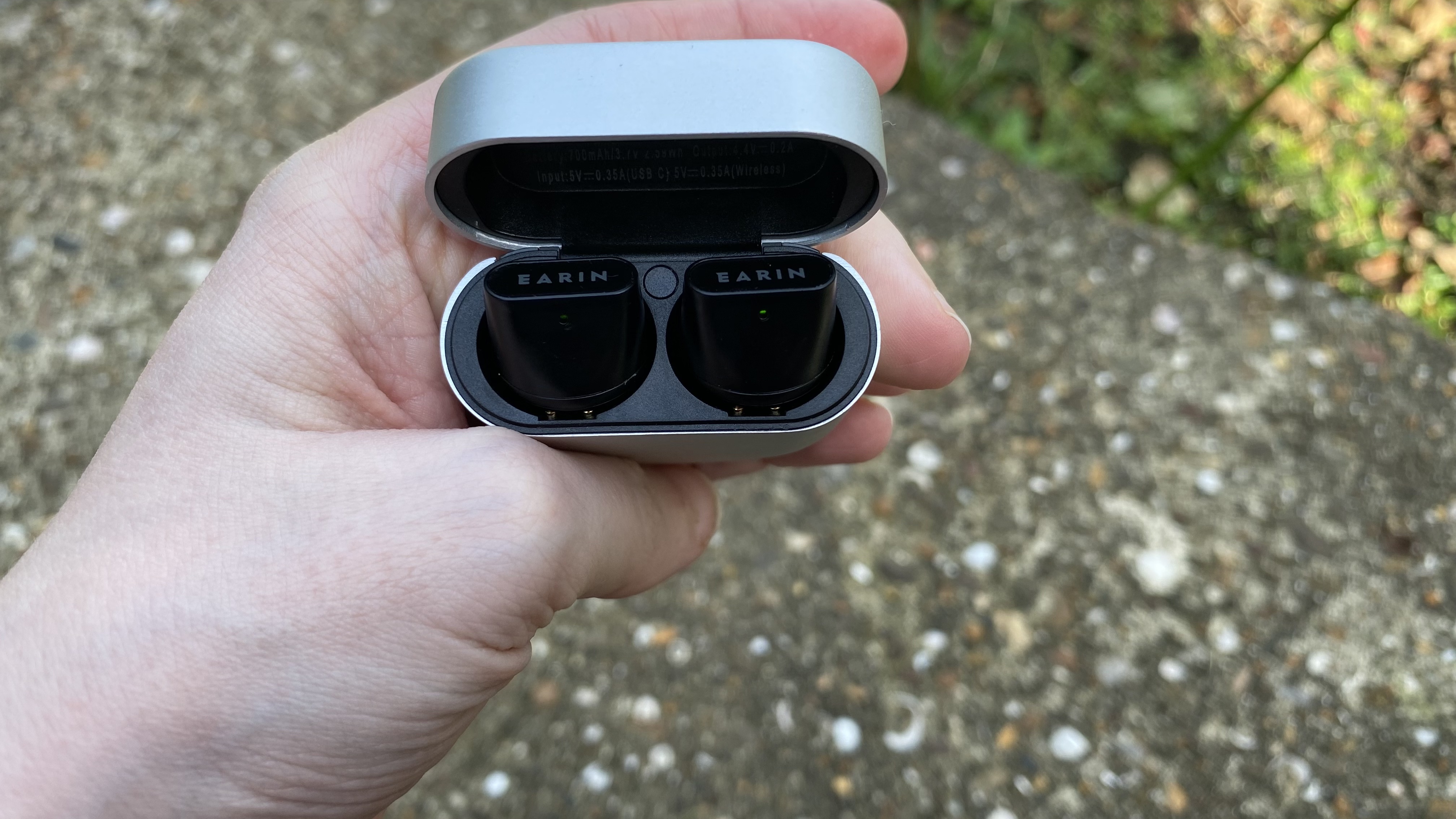 the earin a-3 earbuds in their charging case