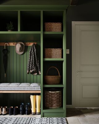 green utility boot room with cream door