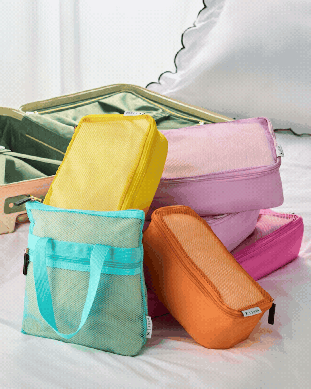 Next Set of 6 Pastel Luggage Packing Cubes in a rotating gif.