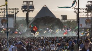 Pyramid stage at Glastonbury surrounded by thousands of people