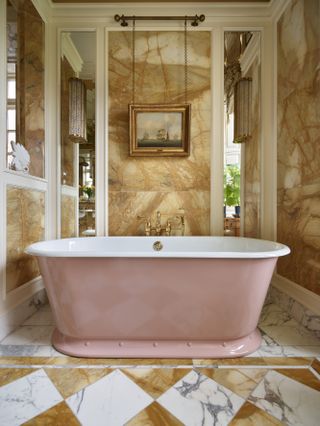 A candy pink bath with studded skirt