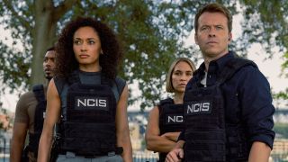 Mackey and JD standing outside with Evie and DeShawn behind them in NCIS: Sydney Season 3 premiere