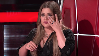 Kelly Clarkson cries after a performance on The Voice.