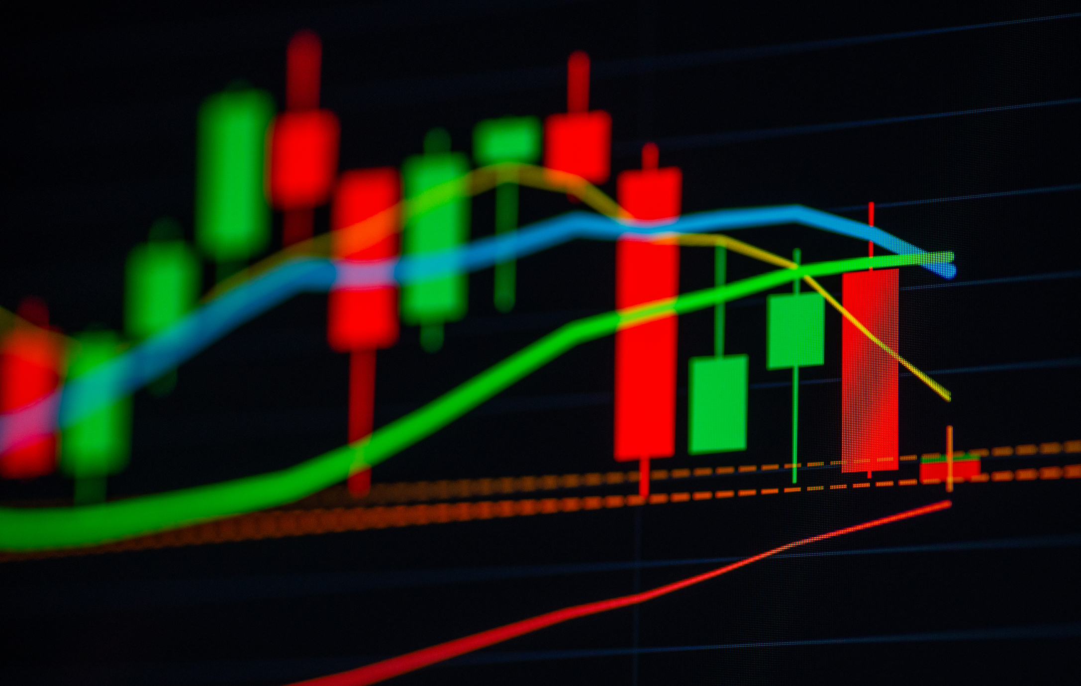 digitally generated image of a candlestick chart in front of a simple background.