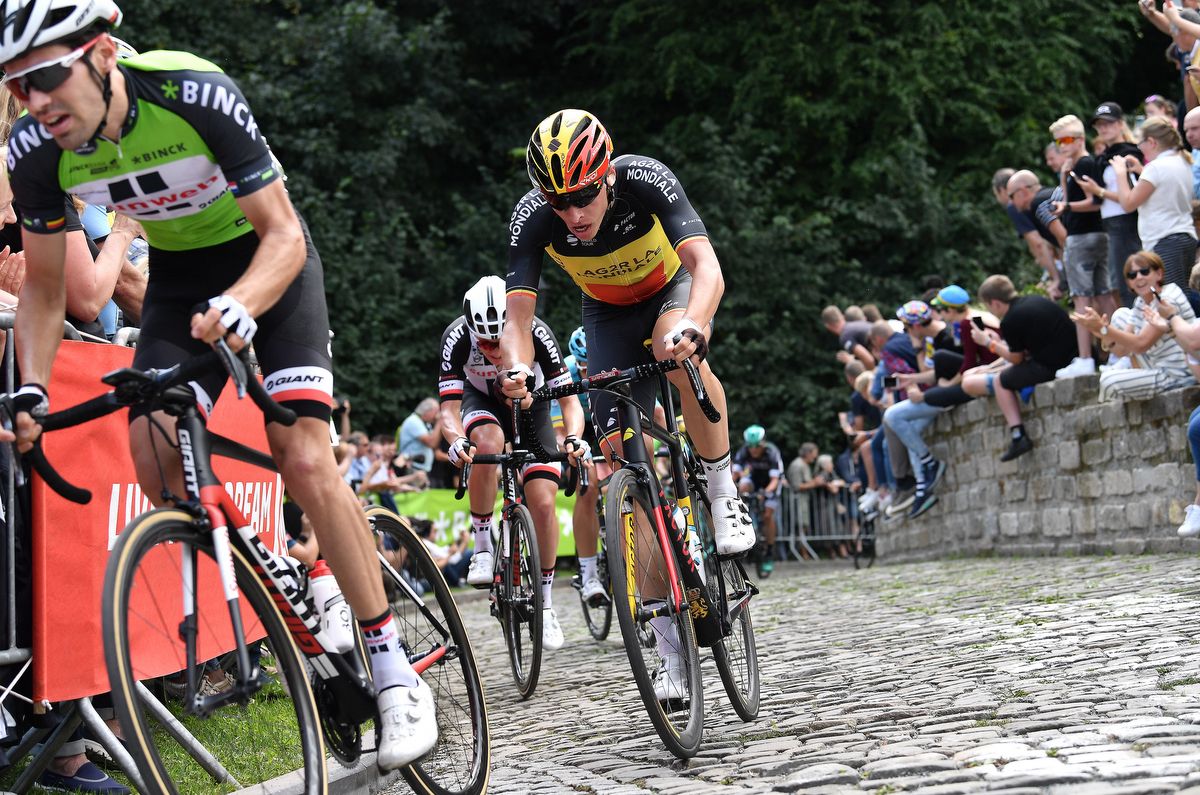 Belgian champion Oliver Naesen following race leader Tom Dumoulin at the top of the Muur