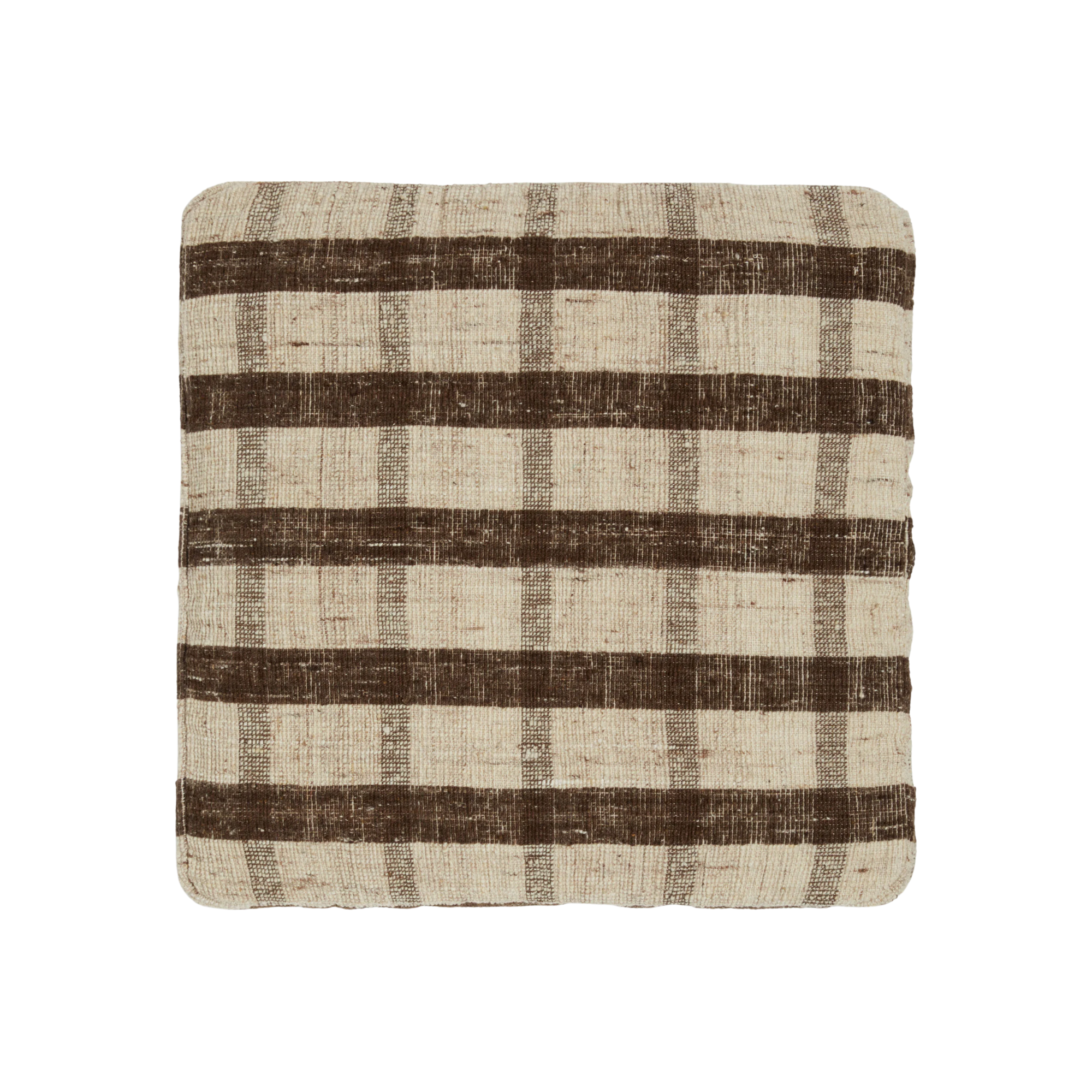 a floor pillow with a brown and cream plaid print