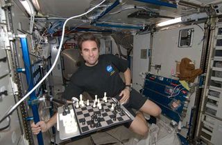 Checkmate: Astronaut Battles Earth in Chess