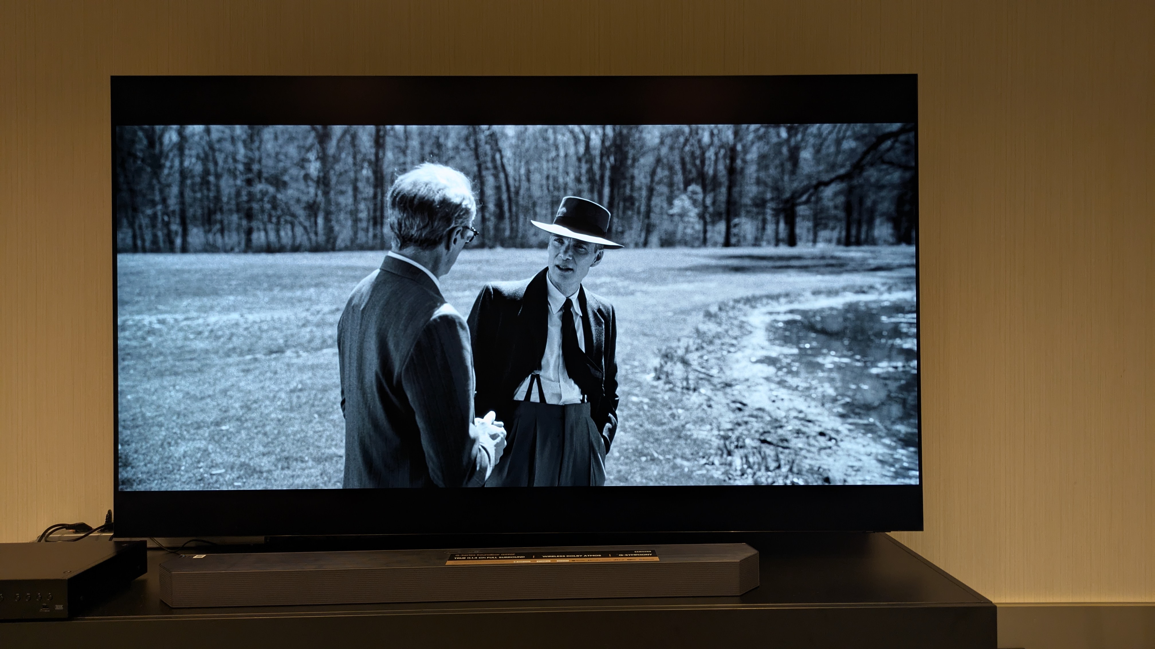 The Samsung S95F TV showing a black and white scene from Oppenheimer