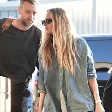 Jennifer Lawrence wearing a denim shirt at the airport