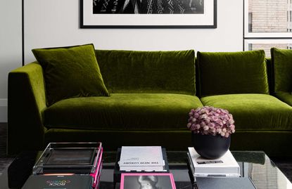 a green sofa in a living room