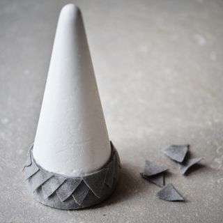 christmas preparation polystyrene cone with hot glue gun