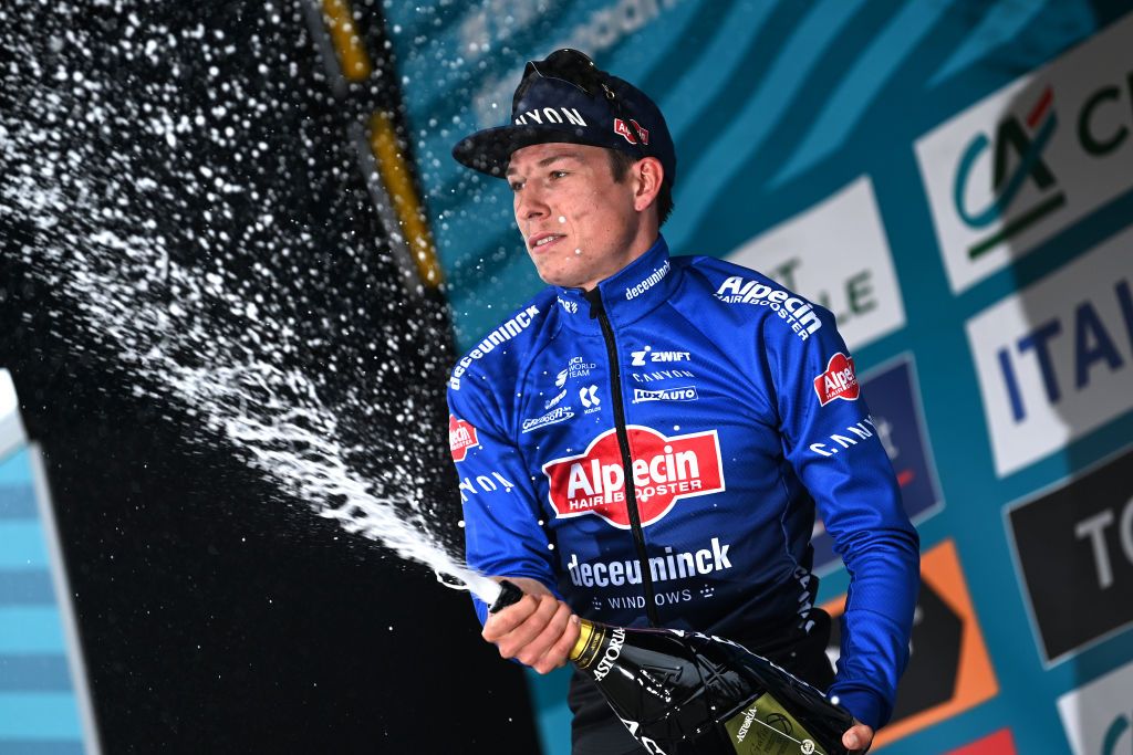 FOLIGNO ITALY MARCH 08 Jasper Philipsen of Belgium and Team AlpecinDeceuninck celebrates at podium as stage winner during the 58th TirrenoAdriatico 2023 Stage 3 a 216km stage from Follonica to Foligno 231m UCIWT TirrenoAdriatico on March 08 2023 in Foligno Italy Photo by Tim de WaeleGetty Images