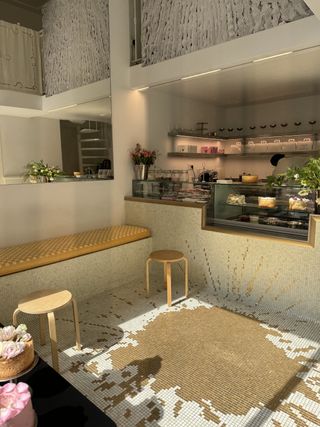Milan cake shop interior with mosaic resembling spilt coffee